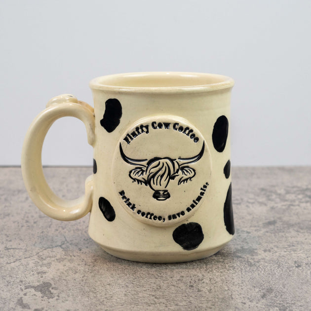 http://fluffycowcoffee.com/cdn/shop/products/fluffy-artisan-mug-black-1_1200x630.jpg?v=1669739854